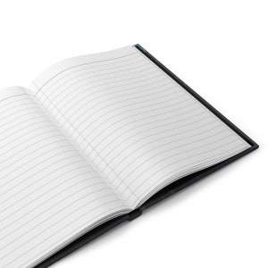 May include: A black notebook with lined pages is open and lying flat on a white surface.
