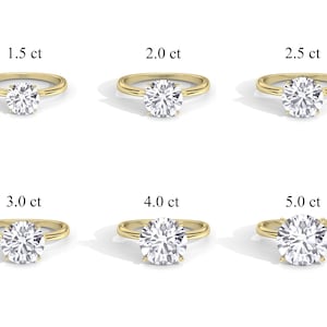 May include: Six gold engagement rings with different sized diamonds. The diamonds are 1.5 ct, 2.0 ct, 2.5 ct, 3.0 ct, 4.0 ct, and 5.0 ct.