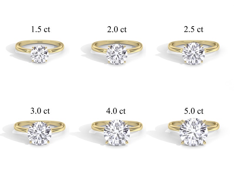 May include: Six gold engagement rings with different sized diamonds. The diamonds are 1.5 ct, 2.0 ct, 2.5 ct, 3.0 ct, 4.0 ct, and 5.0 ct.