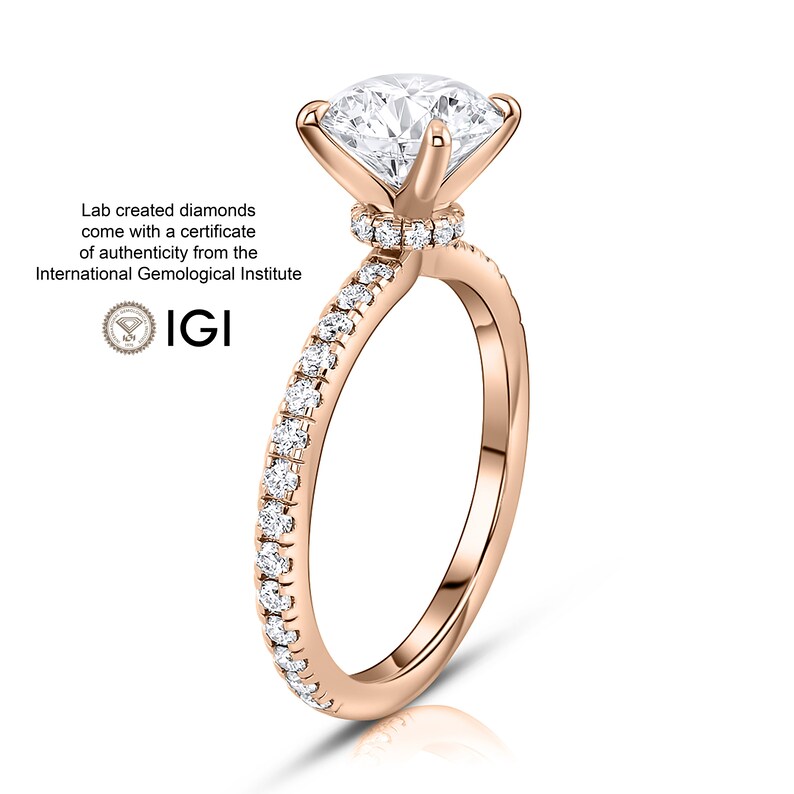 May include: A rose gold engagement ring with a round brilliant cut diamond center stone and a pave diamond band. The ring is set in a classic six-prong setting. Lab created diamonds come with a certificate of authenticity from the International Gemological Institute (IGI).