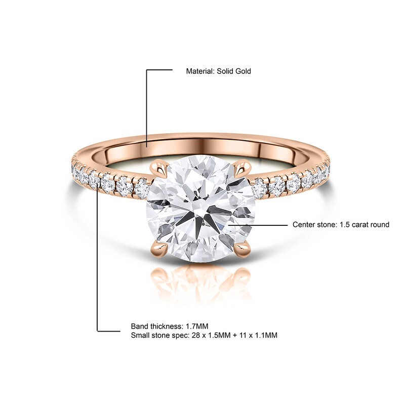 May include: A rose gold engagement ring with a 1.5 carat round center stone and a band of smaller diamonds. The band is 1.7 mm thick and the smaller diamonds are 1.5 mm and 1.1 mm in size. Material: Solid Gold.