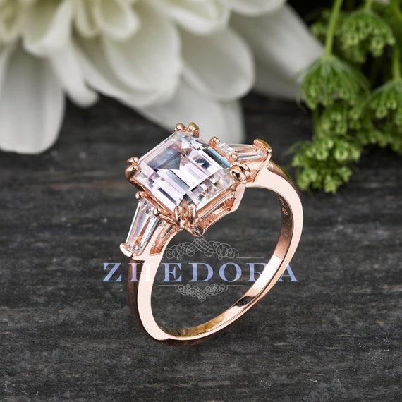 Emerald and asscher cut diamond bespoke engagement rings