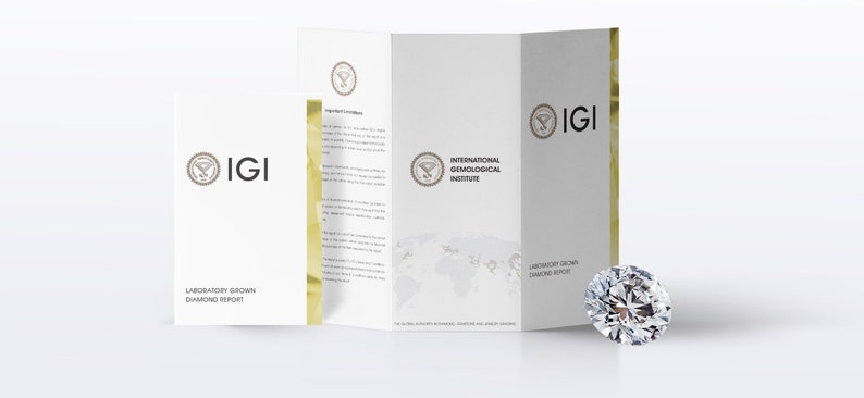 May include: A brilliant-cut diamond next to a white brochure. The brochure displays the IGI logo and text, including "Laboratory Grown Diamond Report." The diamond sparkles, reflecting light. The brochure is open, revealing more text.