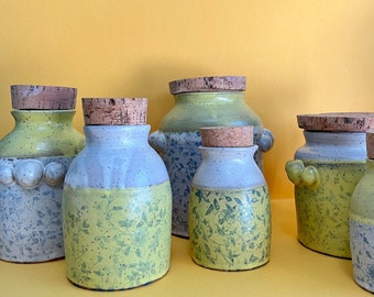 Yellow, White, and Blue Floral Ceramic Canisters with Cork Lids
