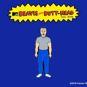 May include: A cartoon character from the TV show Beavis and Butt-Head. The character is a white male with short brown hair and a gray shirt. He is wearing blue jeans and white sneakers. The character is yelling with his mouth open. The image is a pin with the text "MTV Beavis and Butt-Head Mike Judge" in a yellow starburst.