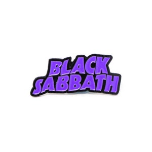 May include: Purple enamel pin with the text "BLACK SABBATH" in a bold, stylized font.