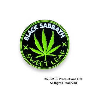 May include: Black Sabbath Sweet Leaf pin with a green marijuana leaf design on a black background. The text "Black Sabbath" and "Sweet Leaf" are in white.