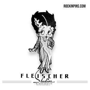 May include: Embroidered patch featuring a black and white cartoon character in a dress and jacket. The character has black hair and large eyes. The patch has the text "ROCKINPINS.COM" at the top and "FLEISCHER Studios" at the bottom.