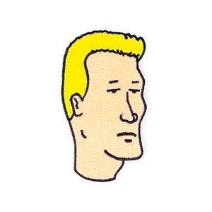 May include: A cartoon illustration of a man with blonde hair and a serious expression. The image is in a simple, black line style.