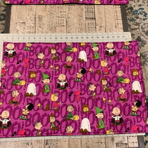 1 handmade quilted table runner. Snoopy, Halloween theme fabric, peanuts decorations, 18” x  21” retired fabric. Sold individually