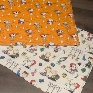 NEW Handmade REVERSIBLE quilted table runner. Snoopy Christmas decorations/Halloween fabric, peanuts decorations New fabric.