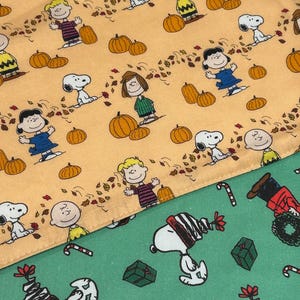 NEW Handmade REVERSIBLE quilted table runner. Snoopy Christmas decorations/fall fabric, peanuts decorations New fabric. New fabric, pumpkins