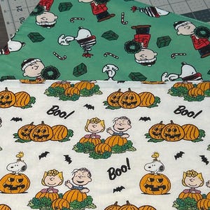 NEW Handmade REVERSIBLE quilted table topper table runner. Snoopy Christmas decorations/halloween fabric, peanuts decorations New fabric.