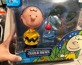 Charlie Brown Christmas figurine with unique accessories, Christmas tree. Opened box. Gentle used.