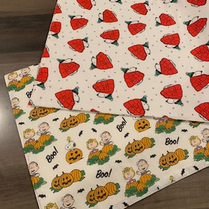 NEW Handmade REVERSIBLE quilted table topper table runner. Snoopy Christmas decorations/Halloween fabric, peanuts decorations New fabric.