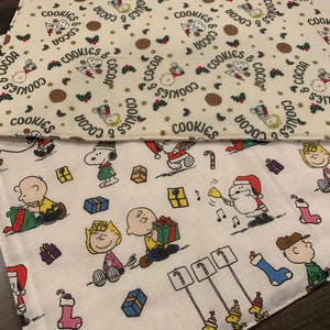NEW Handmade REVERSIBLE quilted table runner. Snoopy Christmas decorations/ Christmas fabric, peanuts decorations New fabric.