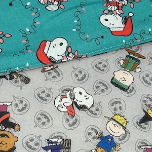 NEW Handmade REVERSIBLE quilted table topper table runner. Snoopy Christmas decorations/Halloween fabric, peanuts decorations New fabric.