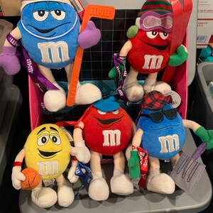 Lot of 5 m&m stuffed animals, plush. 2 Blue, 2 Red and 1 Yellow. Sports. Basket, skiing, baseball and hockey. SEE PICTURES for DETAILS