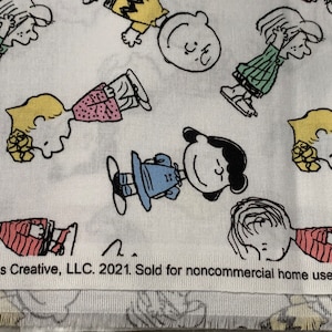 Listing for peanuts gang fabric. Comics. Sold by a half yard Peanuts fabric.
