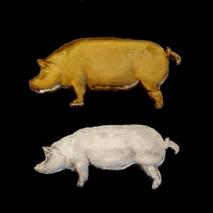 May include: Two pig figurines, one is a light brown color and the other is a light gray color. Both are in a side profile pose.