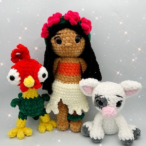 May include: Three crocheted stuffed toys: a red and green rooster, a white calf, and a girl with brown hair wearing a flower crown and a white skirt.