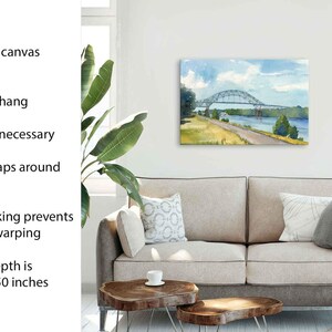 May include: A stretched canvas print of a watercolor painting of a bridge over a river. The canvas depth is 1.25 to 1.50 inches. The print is ready to hang, with no frame necessary, and the image wraps around the sides.