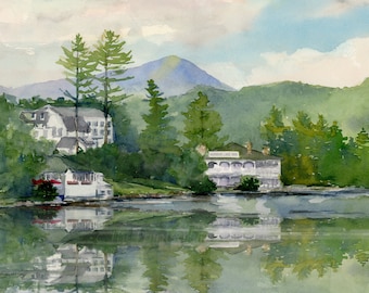 May include: Watercolor painting of a lake scene with two white buildings on the shore. The buildings are surrounded by green trees and a mountain in the background. The lake is reflecting the sky and the buildings.
