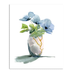May include: A watercolor painting of a bouquet of blue flowers in a white vase with gold crackle detailing.