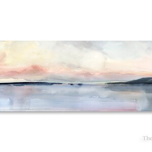 May include: A watercolor painting of a seascape with a soft pink and yellow sky, a dark blue horizon, and a light blue reflective water surface.