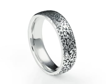 A platinum wedding ring with a laser engraved scroll motif. hatton garden london jewellers