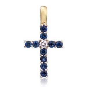 May include: A gold cross pendant with a white diamond in the center and blue sapphires around the edges.