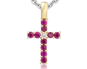 A stunning 18ct yellow gold cross pendant with a diamond surround by 10 rubies. Supported on an 16 inch 18ct yellow gold chain.
