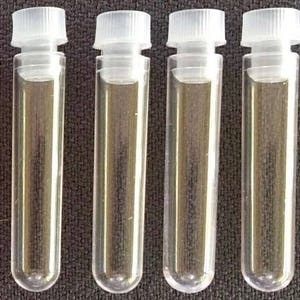 May include: Six clear plastic vials with white screw-on caps. The vials are empty and have a round bottom.