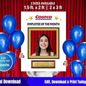 May include: A white photo booth prop with a gold frame and the text "COSTCO WHOLESALE EMPLOYEE OF THE MONTH". The prop has a space for a photo and a nameplate that says "INSERT NAME". The prop is decorated with blue balloons and a red curtain in the background.