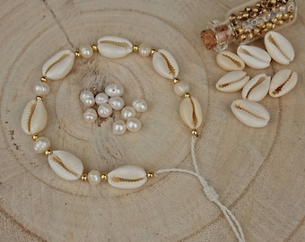 Shell bracelet with freshwater pearls and cowrie shells