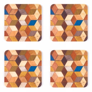 May include: Set of four square coasters with a geometric cube pattern. The coasters feature a mosaic design with various wood tones, including brown, tan, and blue. Each coaster has rounded corners and a white background.