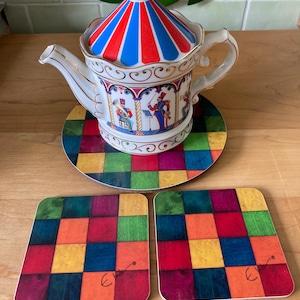 Regnbågsställ för tekanna: Värmebeständigt melaminunderlägg för tekanna Lägg till underlägg i kassan