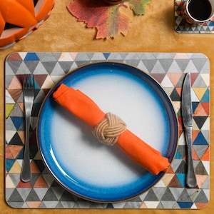 Large placemat of the highest quality. Multi colour mosaic Harlequin design. Heat proof Melamine. Strong and long lasting. Single or sets