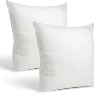 May include: Two white pillow inserts, made of soft, breathable material. The pillows are rectangular and have a smooth, even surface.
