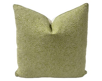 May include: A green and white patterned throw pillow with a subtle leaf design. The pillow has a white border and is made of a soft, comfortable fabric.