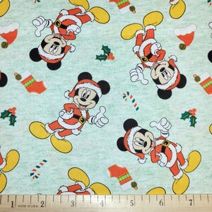 Disney Mickey Mouse Christmas Toss in Green 100% Cotton Fabric From Springs Creative