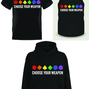 May include: Black t-shirt, tank top, and hoodie with a rainbow design of dice and the text "Choose Your Weapon".