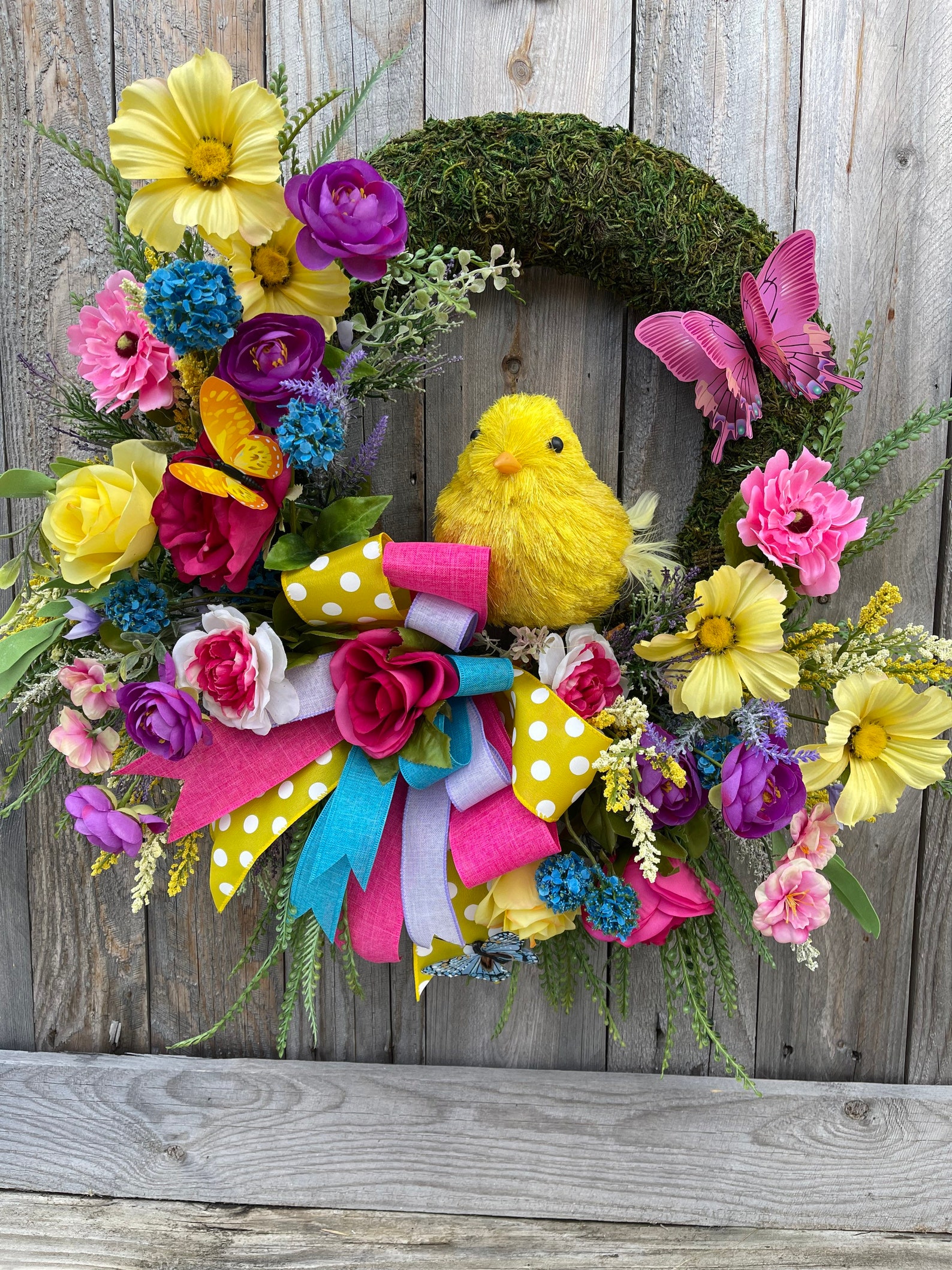 Partially Covered Chick Moss Wreaths with Flowers and Greenery Partially Covered Chick Moss Wreaths with Flowers and Greenery