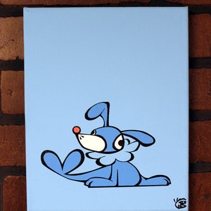 May include: A blue cartoon dog with a red nose and black eyes is painted on a light blue canvas. The dog is sitting on its hind legs with its tail curled around its front legs. The dog is looking to the right.