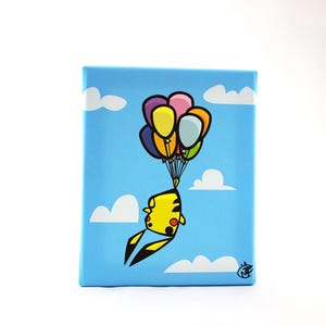 May include: A square canvas art piece featuring a cartoon Pikachu character suspended by colorful balloons against a blue sky with white clouds. The artwork has a playful and whimsical theme.
