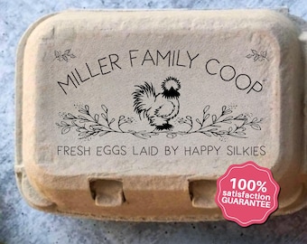 May include: A cardboard egg carton with the text "MILLER FAMILY COOP" and "FRESH EGGS LAID BY HAPPY SILKIES" printed on it. A black illustration of a rooster is in the center. A pink sticker reads "100% satisfaction GUARANTEE".