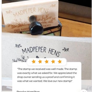 May include: A rectangular wooden rubber stamp with a black handle, featuring the engraved text MADPEPER HENS and floral illustrations. Below, a printed impression of the stamp on paper displays the same text and design, accompanied by a five-star review.