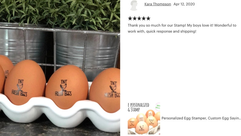 May include: Brown eggs in a white carton, each stamped with "TNT FRESH EGGS" in black ink. The eggs are in front of a metal container with greenery in the background. The image also includes a customer review.