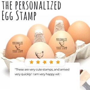 May include: A carton of brown eggs, some stamped with a chicken graphic and the words "PERSONALIZE YOUR STAMP." The text "THE PERSONALIZED EGG STAMP" is at the top. A customer review with five stars is also visible.