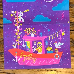 Carte imprimée en riso ouverte de 4 x 8 pi, fille qui vit dans une péniche, voile douce imprimée sur la couverture.